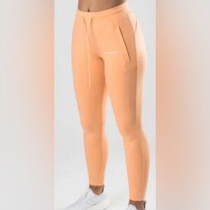 NWT ALPHALETE Women's Essential Core Jogger ORANGE FROST size Medium